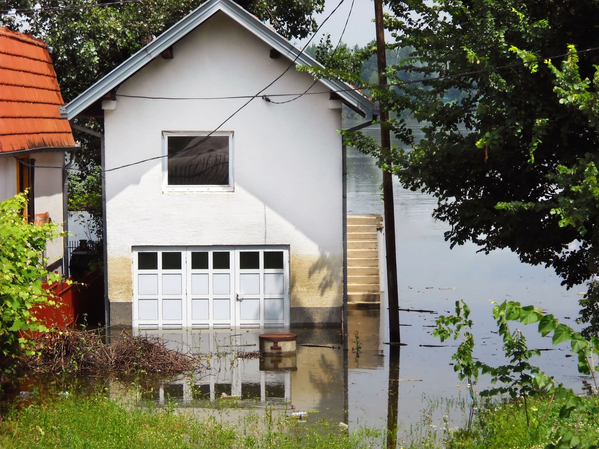 Save Download Preview house surrounded by water in river during spring flood