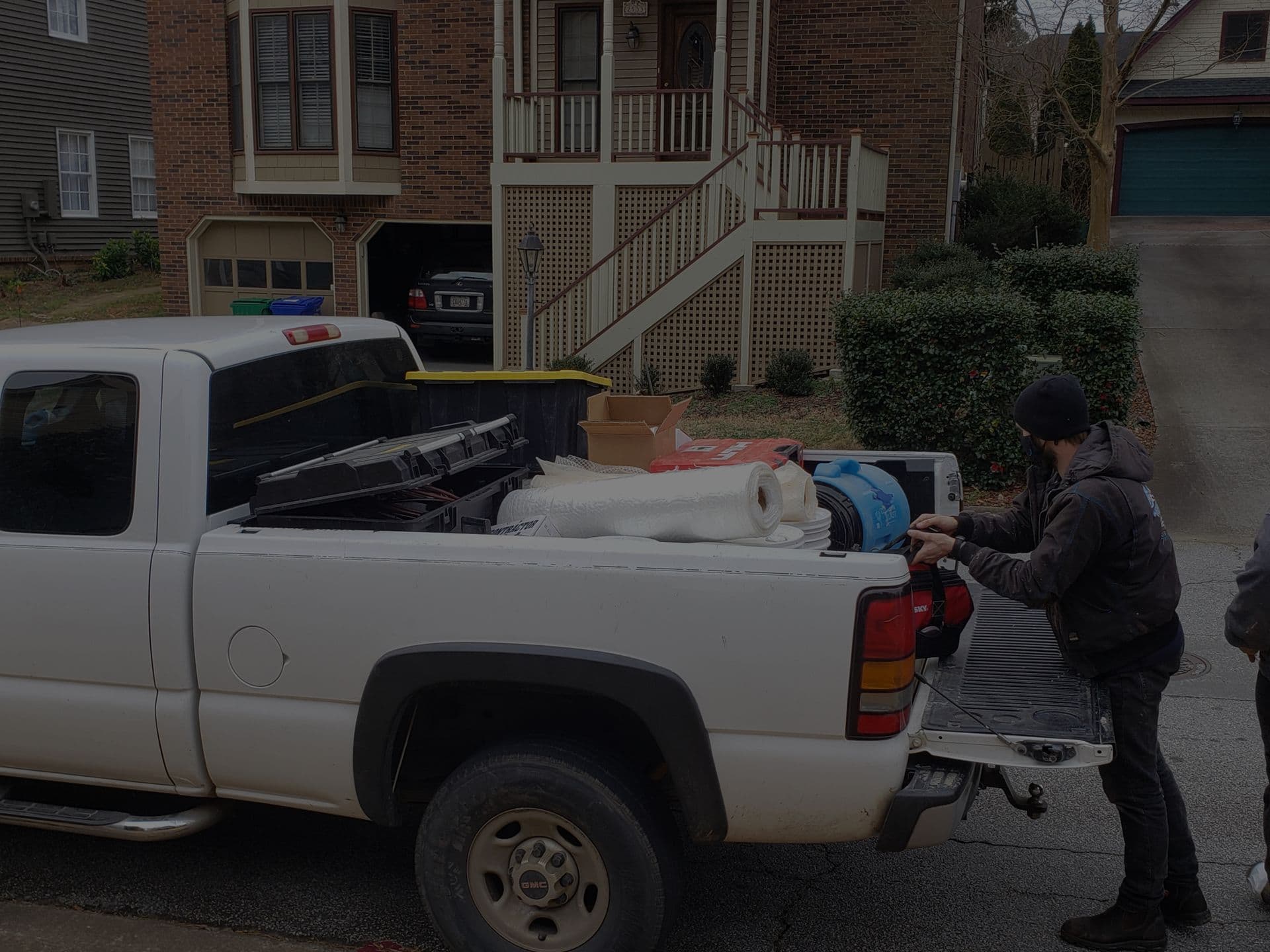 Services banner - truck with guy loading it
